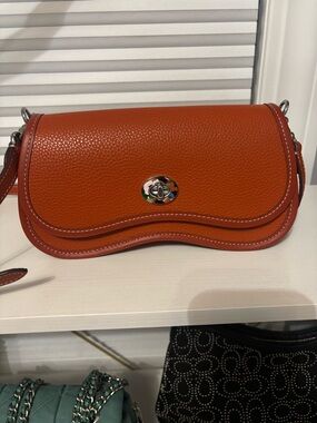 Orange Pebbled Leather Crossbody Bag with Turn-Lock Closure